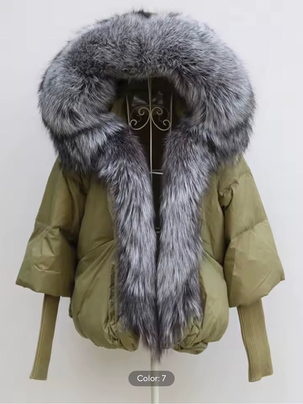 Olive green puffer jacket with grey fox fur trim hood